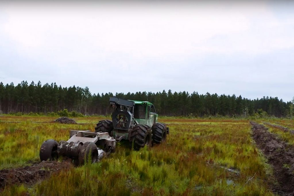 Skidder with Savannah Plow pulling rows