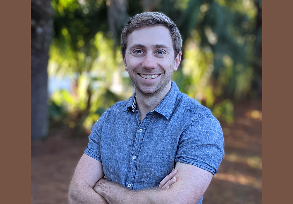 Research and Development Coordinator Trevor standing in a forest