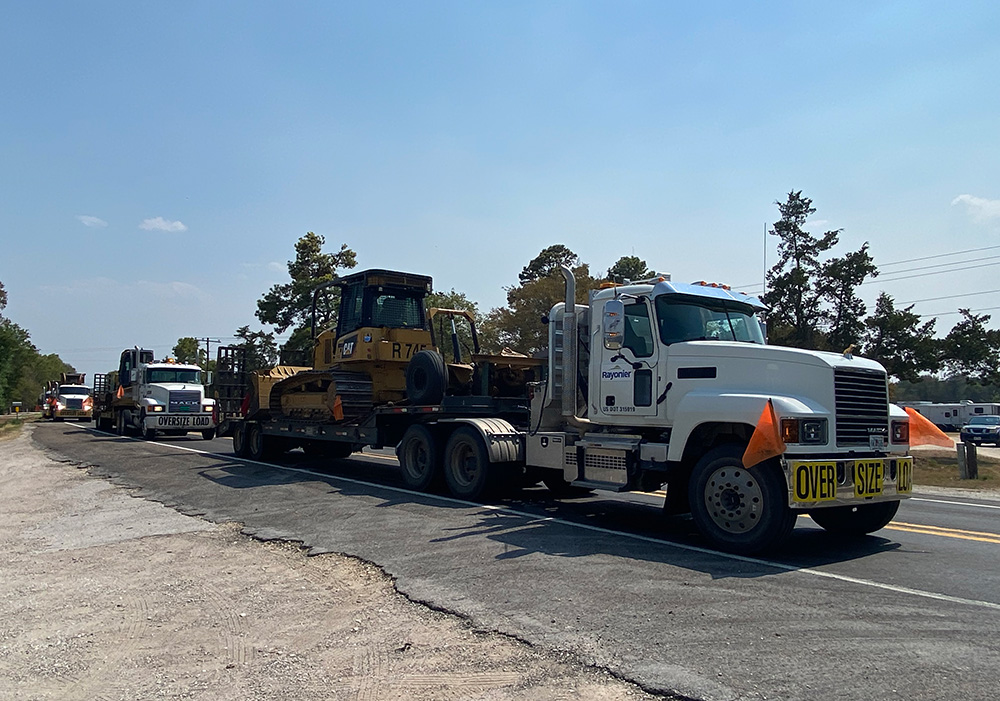 Semi-Trucks Transporting Equipment and Firefighting Crew