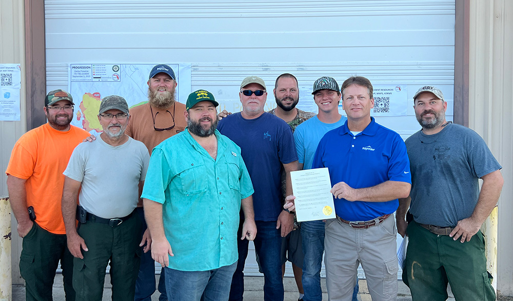 Group of Firefighters being recognized for their heroic work in fighting wildfires